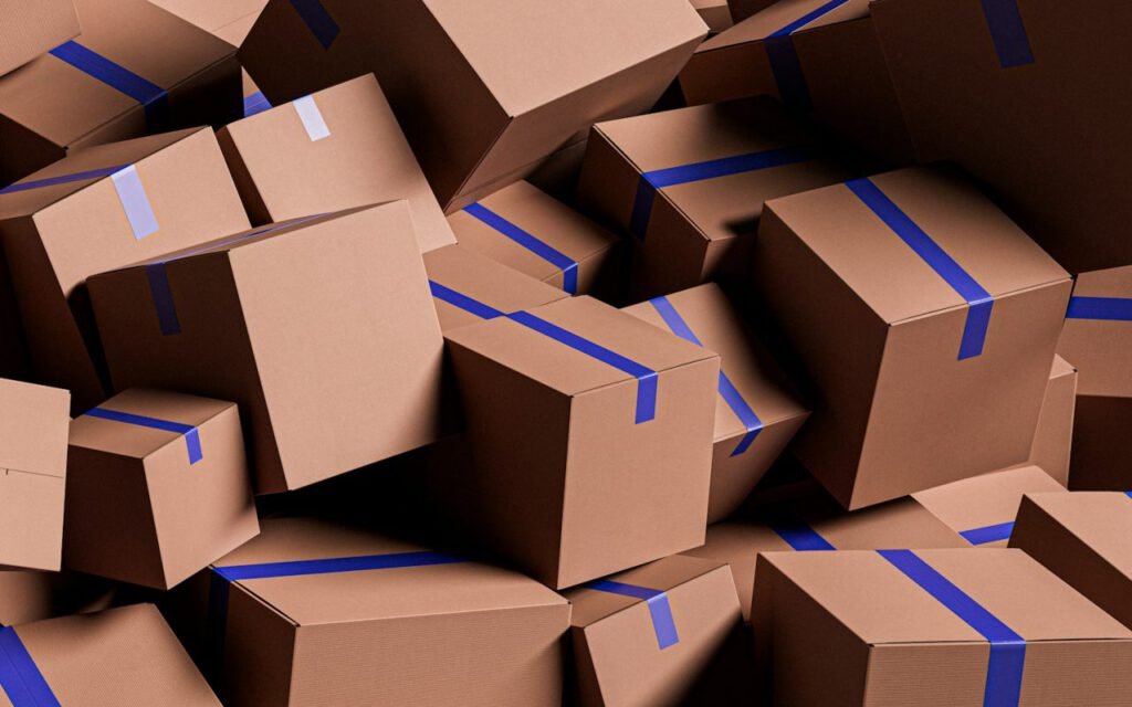 A pile of cardboard boxes stacked in a room
