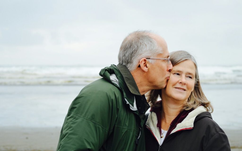 An older couple sitting together and smiling