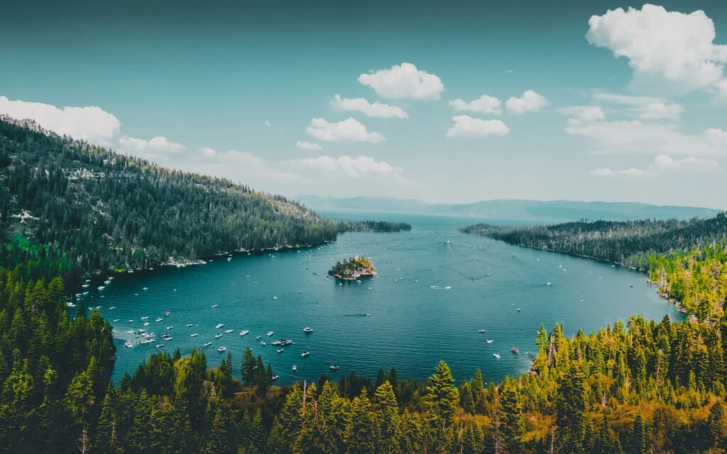 Calm blue mountain lake with a rocky shoreline