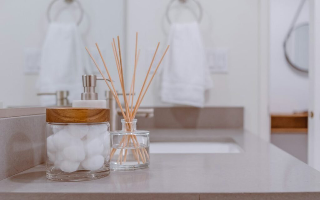 A tidy bathroom shelf with towels and toiletries