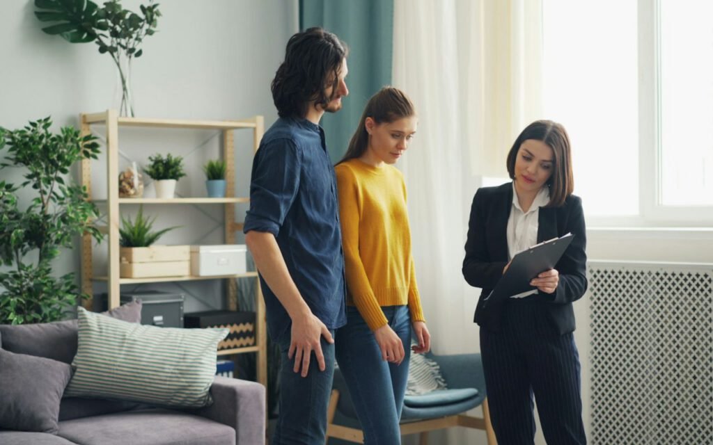 A plumber talking with a homeowner during a home visit