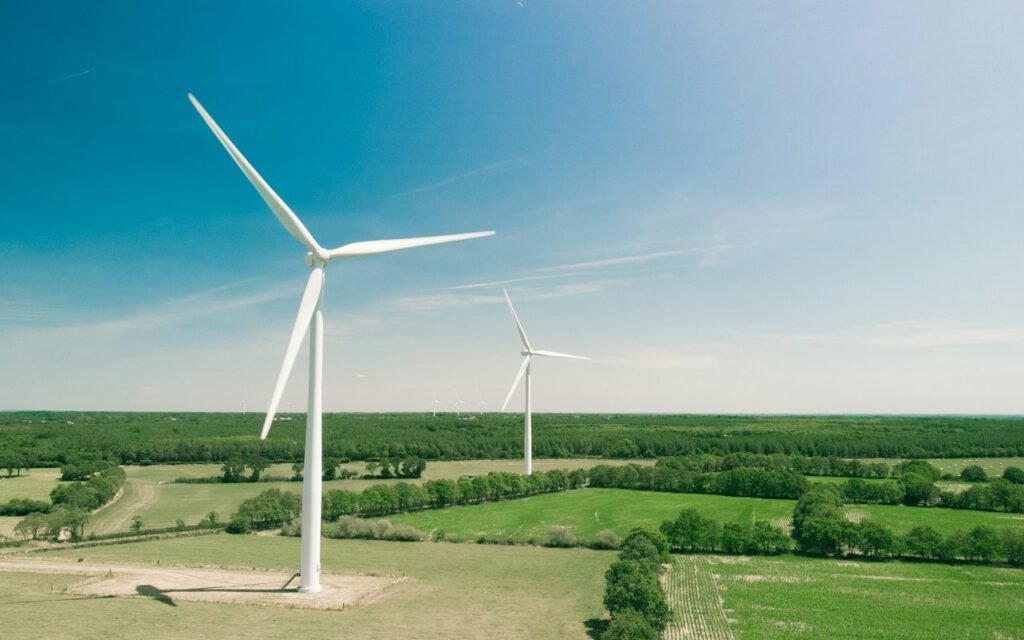 A wind farm with rows of turbines across open land