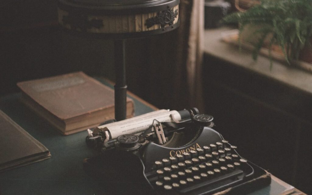 A vintage typewriter with a sheet of paper loaded