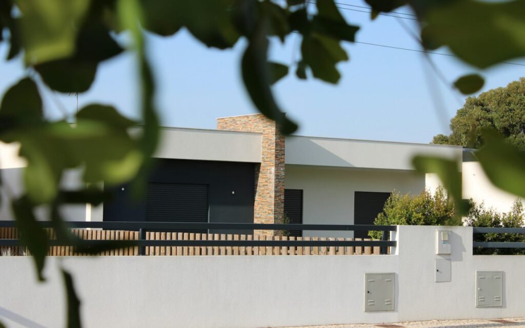 A contemporary house surrounded by mature trees