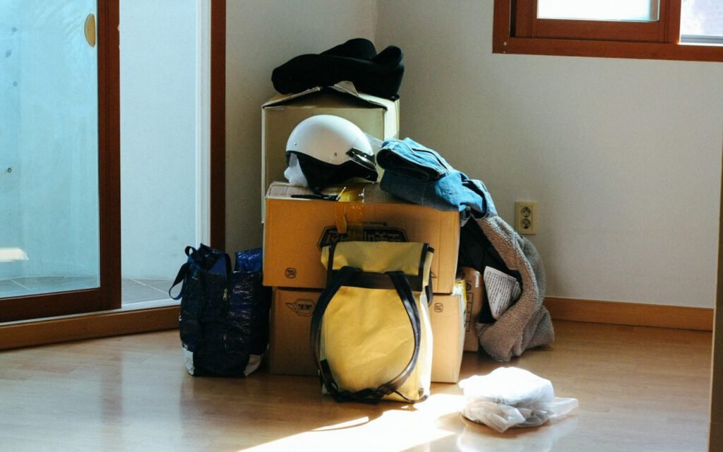 An empty, freshly cleaned room with bare floors and bright windows
