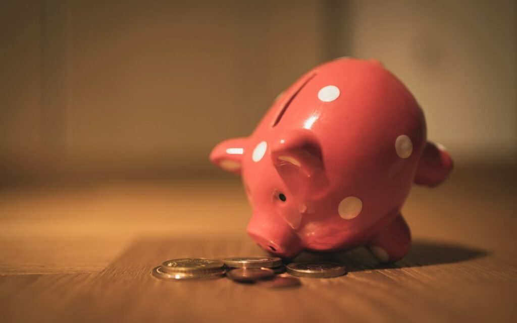 A pink piggy bank on a table