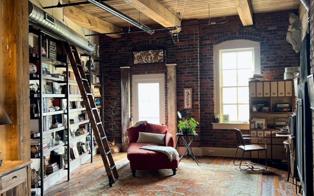 A rolling ladder against tall wooden library shelves