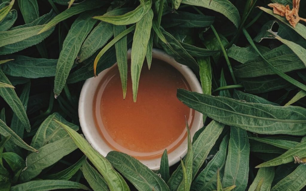 A cup of herbal tea steaming on a small table