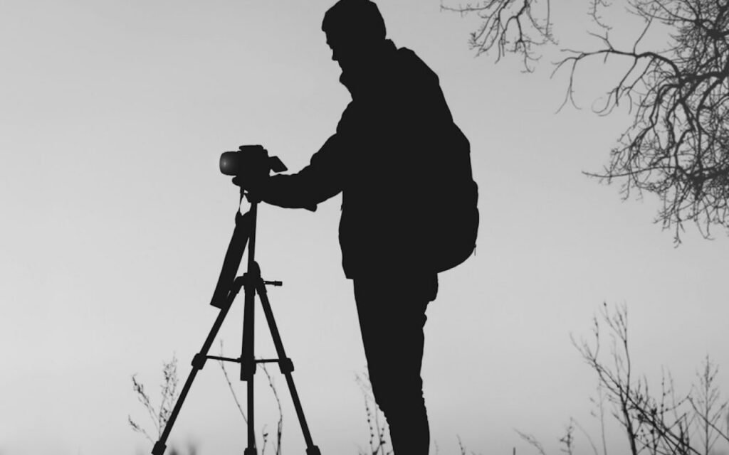 Camera on a tripod facing a low evening sun