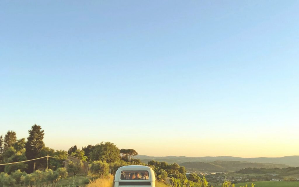 A small van parked at the side of a quiet road