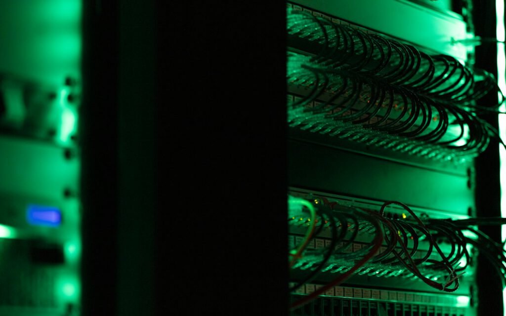 Rows of servers with blinking lights in a dim server room