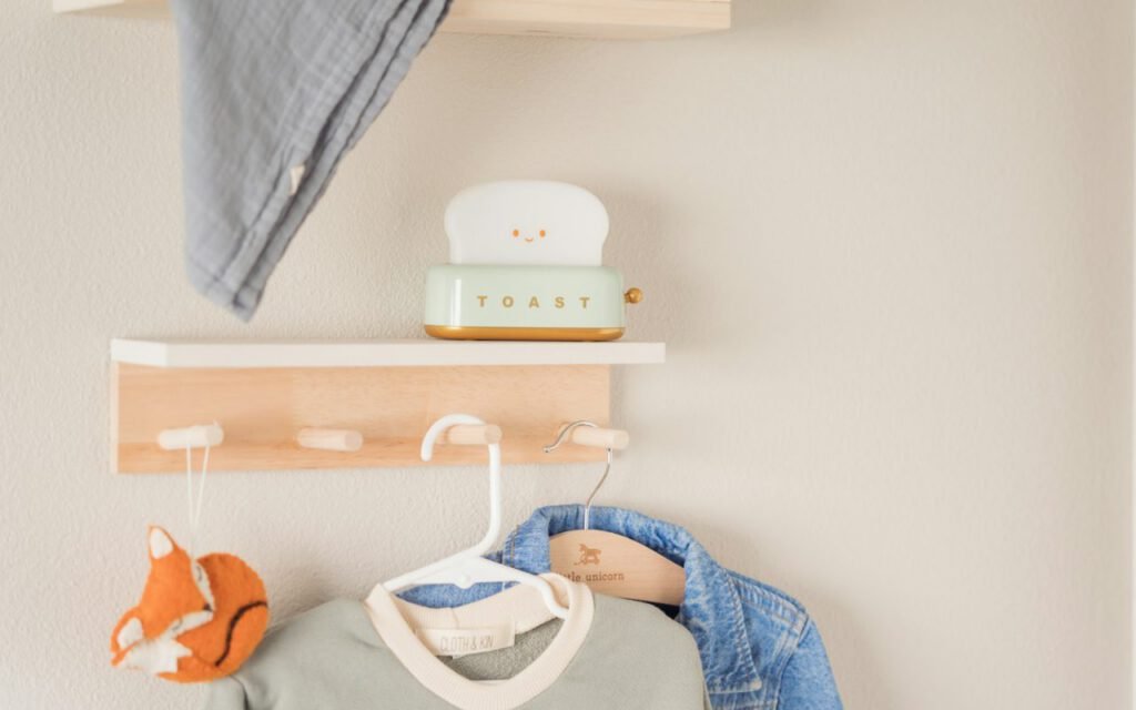 A tidy nursery shelf stocked with baby supplies