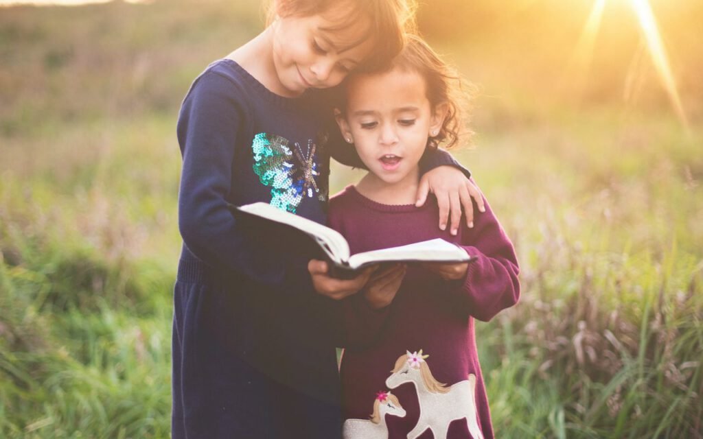 A parent and child reading a book together in a cozy setting