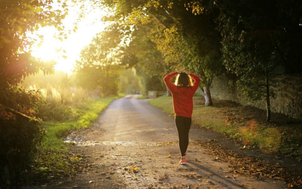 A runner on a paved path along the water