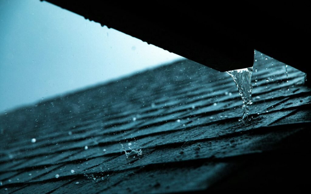 Rain running off the edge of a roof