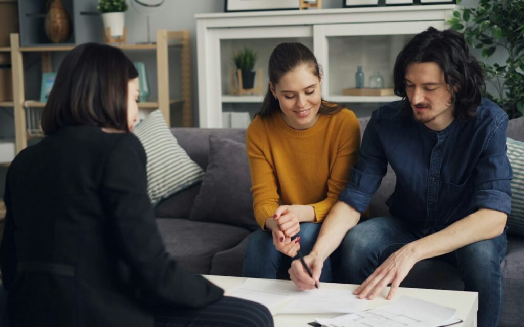 Two people relaxing together on a sofa in a cozy living room