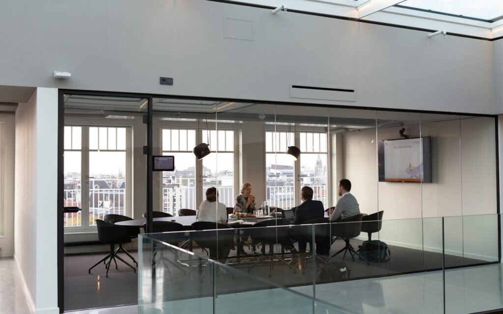 A group of colleagues gathered around a table in a meeting