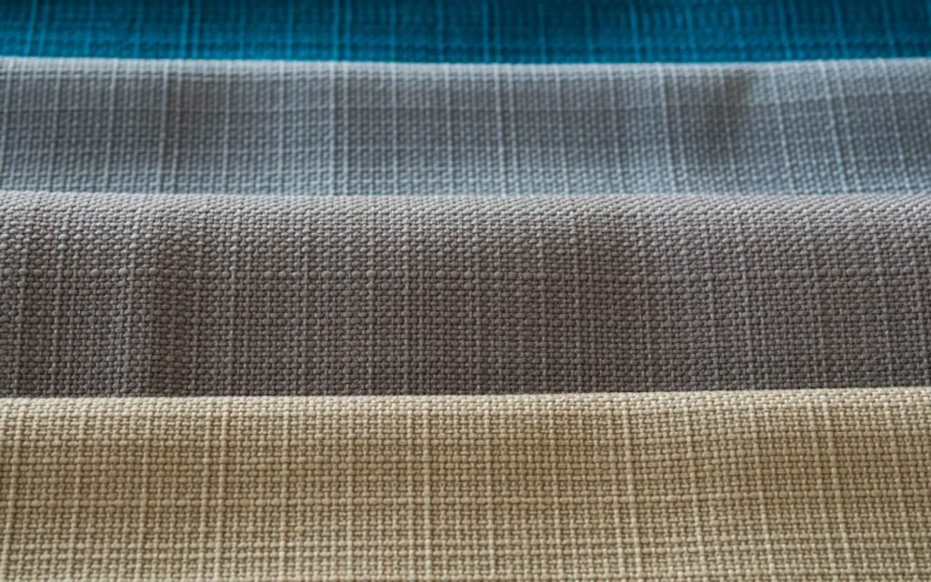 A spread of fabric swatches in different textures and tones