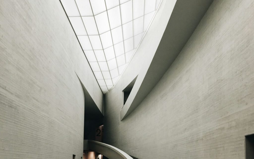 Bright white modern museum interior with tall walls