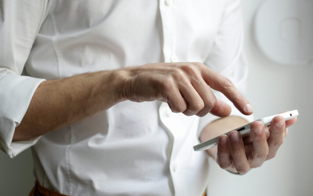 Hands holding a smartphone to read a message