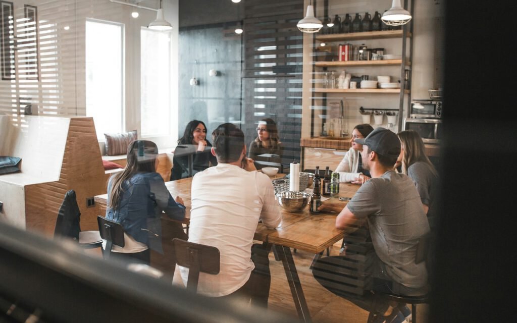 A small team gathered around a table in a meeting