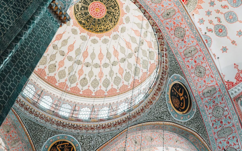 Interior view looking up into a decorated mosque dome