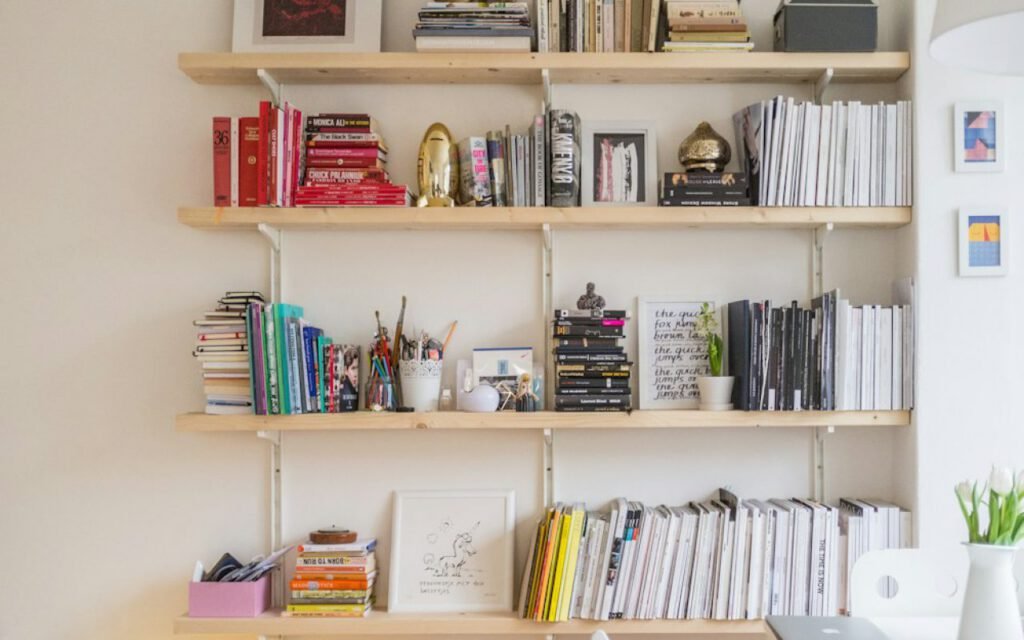 A home bookshelf with books and small decor