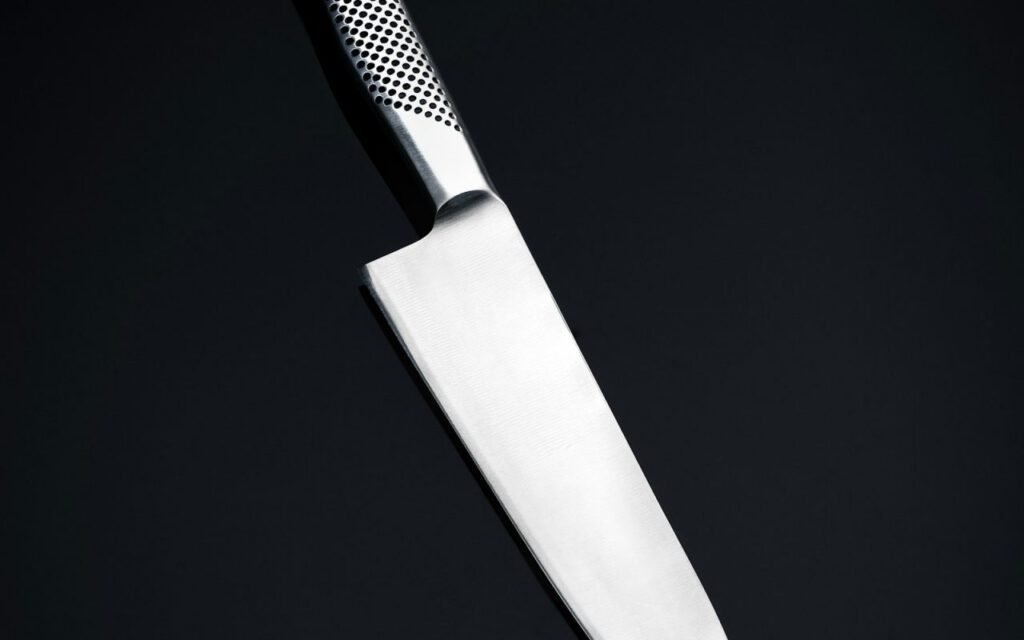 Chef's knife resting on a kitchen counter