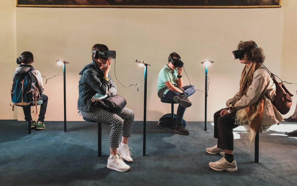 Group of people trying games with virtual reality headsets
