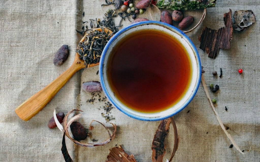 Cup of herbal tea on a wooden table