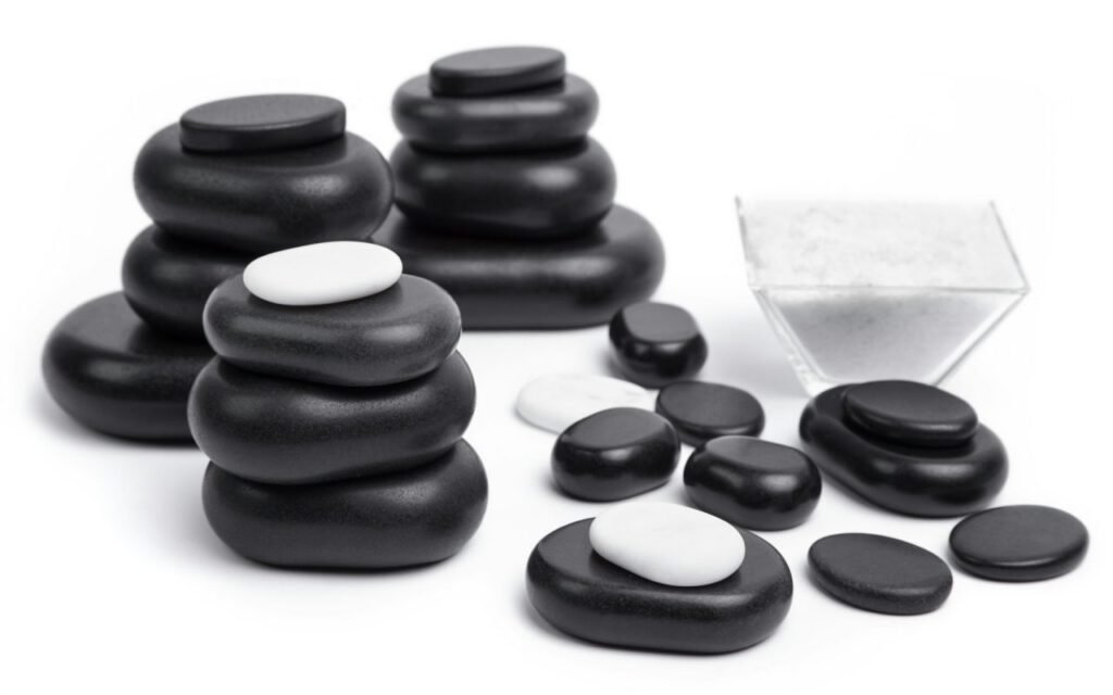Stack of smooth black basalt massage stones