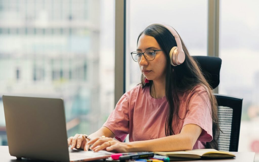 A pair of headphones resting near a bright window