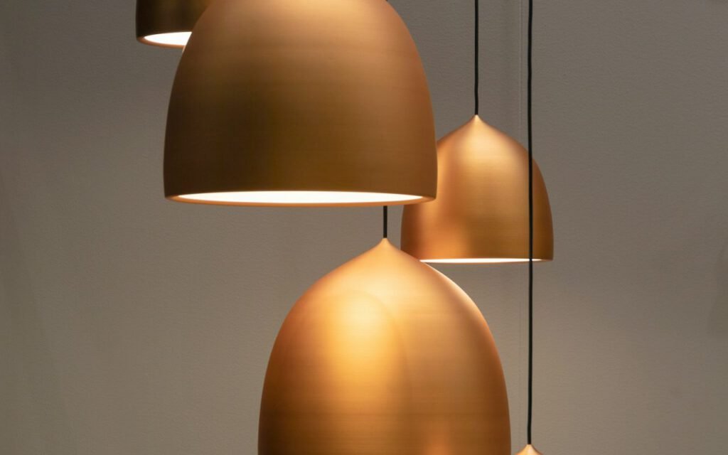 A soft white pendant lamp hanging in a calm interior