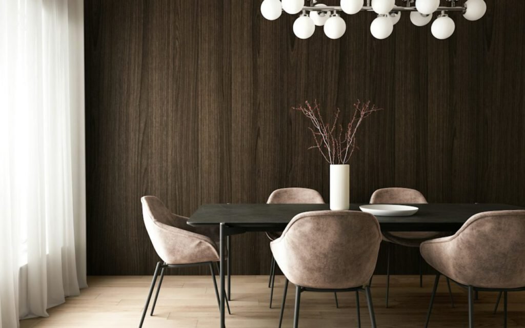 A bright dining room with a wooden table, mixed chairs and plants