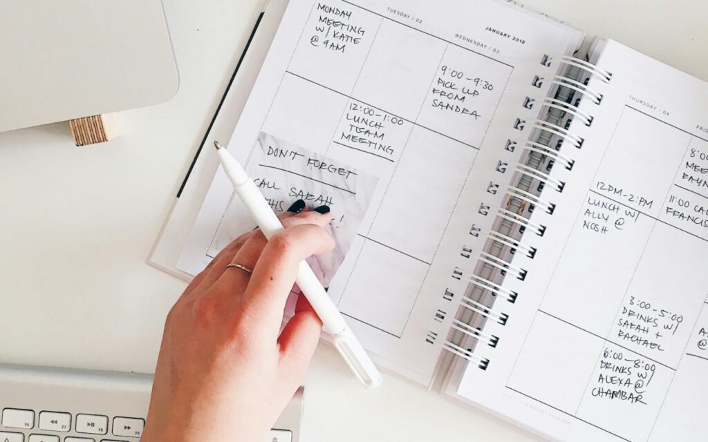 Notepad and pen on a desk for planning a weekly schedule