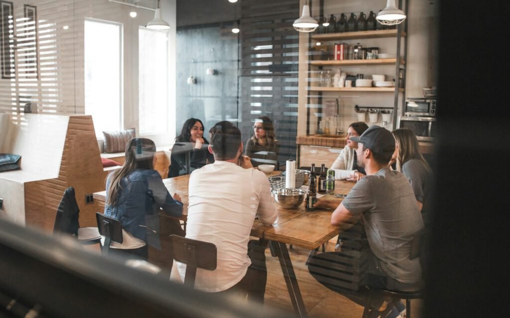 Small group of people studying together at a cafe table