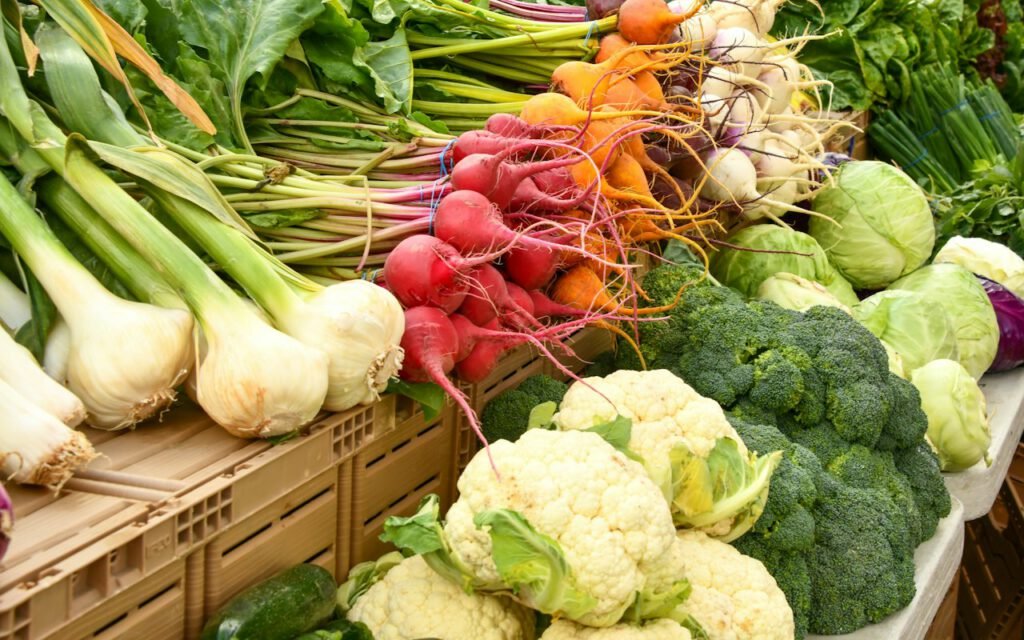 Baskets of fresh produce at an outdoor farmers market
