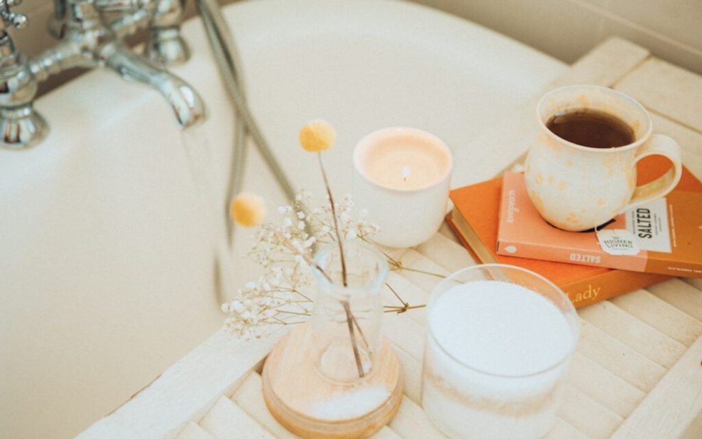 A person relaxing in a warm bath by soft light