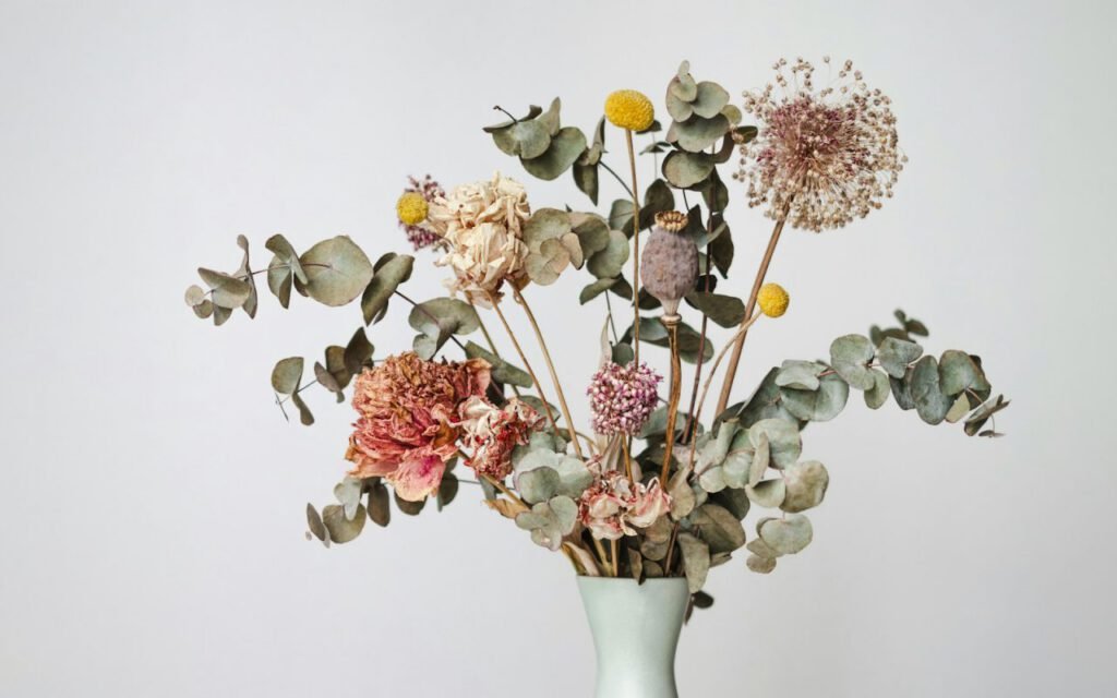A bunch of dried flowers in soft colors