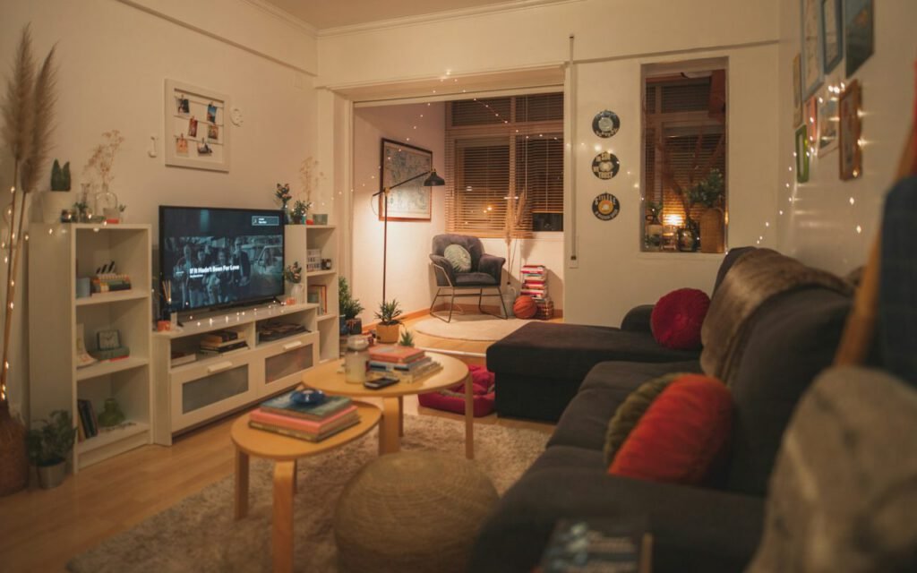 A cozy living room with a soft blanket on the sofa