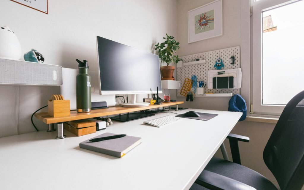 A clean white desk ready for a creative project