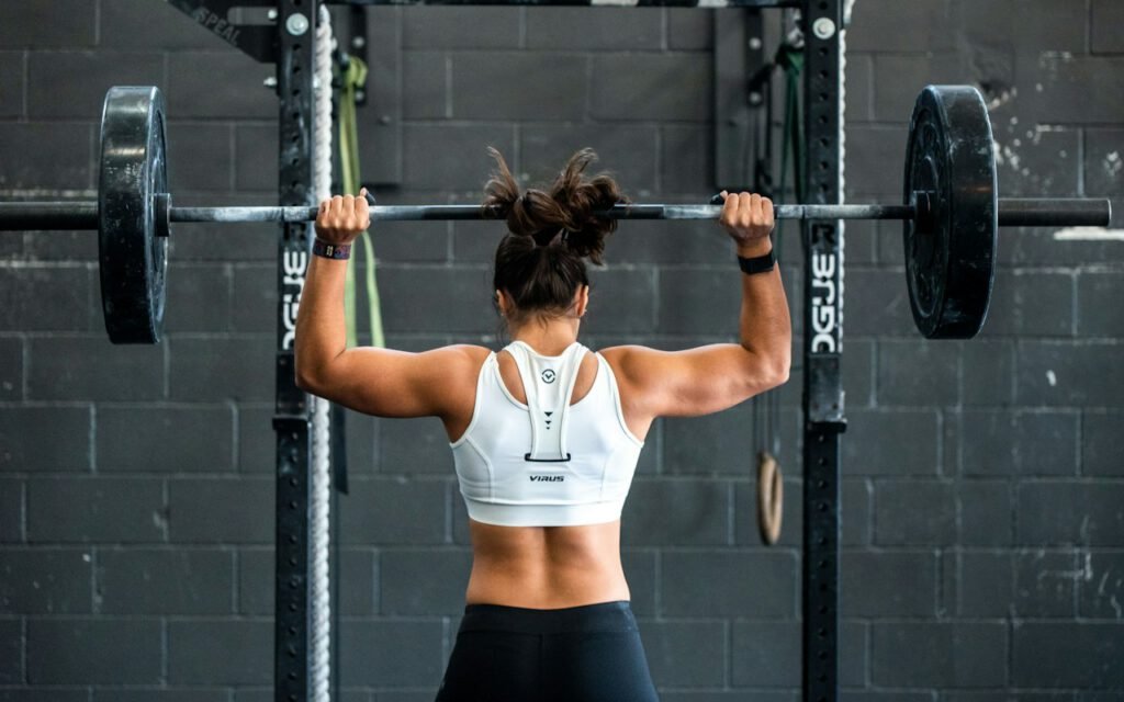 A person training upper-body strength in a gym