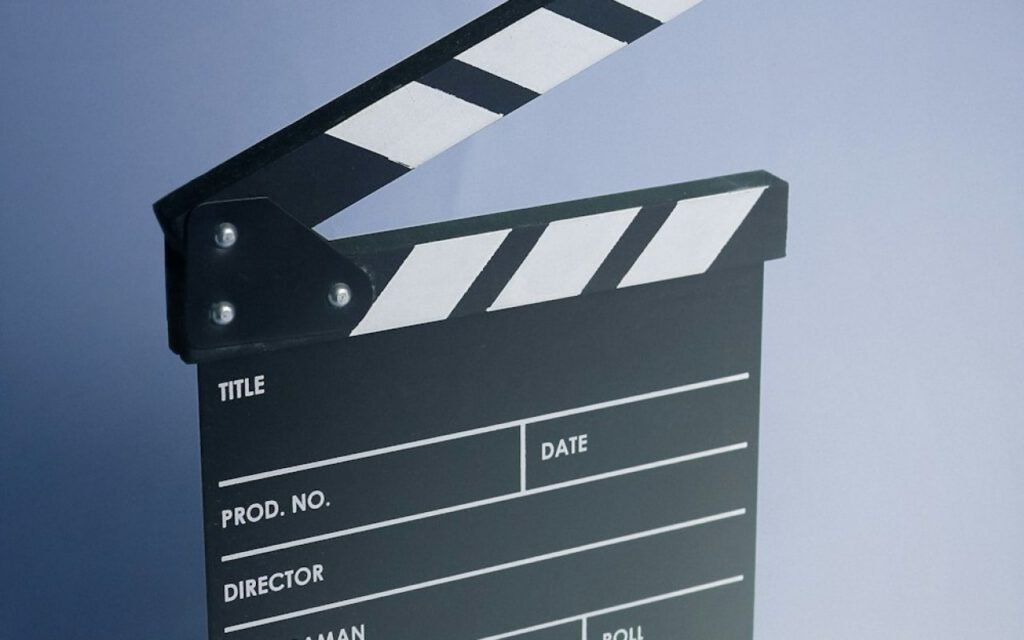 A clapperboard being marked at the start of a take