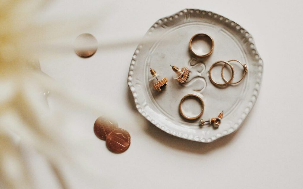 An assortment of rings and jewelry laid out on a flat surface