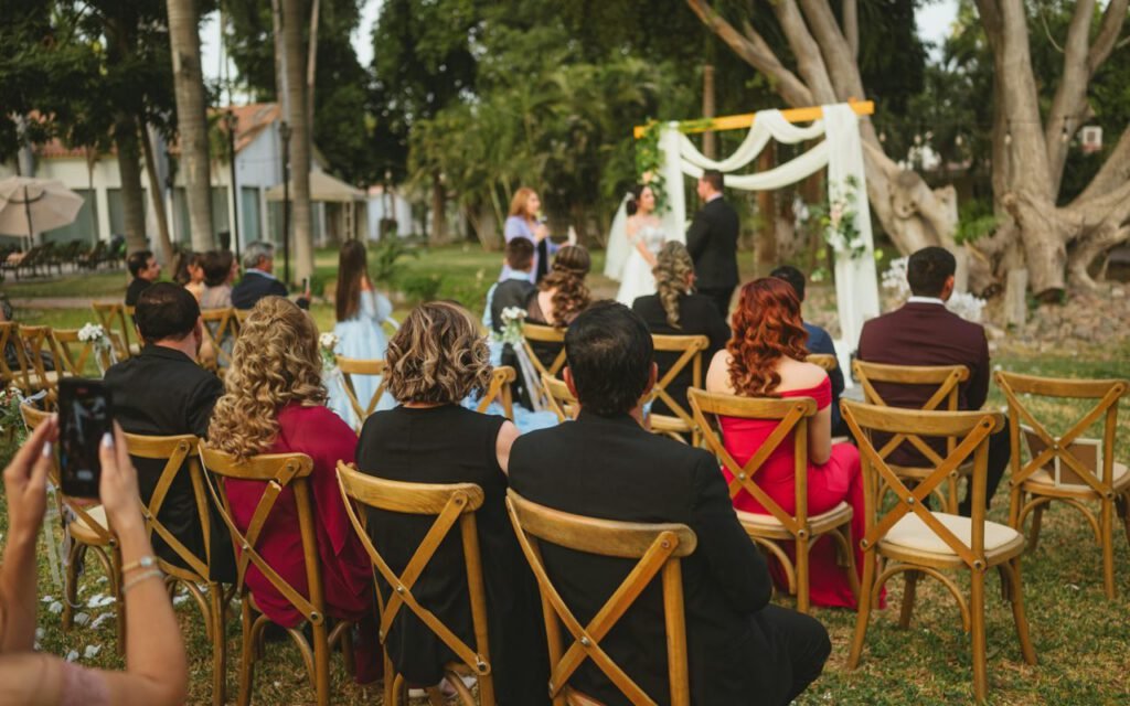 A wedding ceremony setup with chairs facing an altar