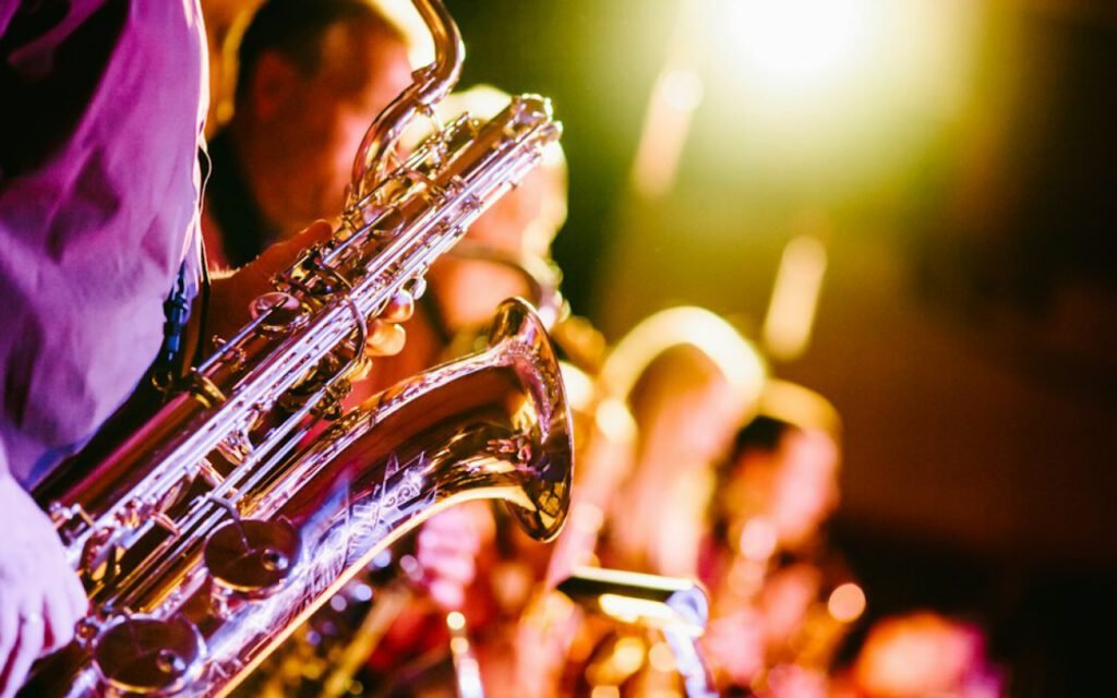 A musician playing saxophone on stage