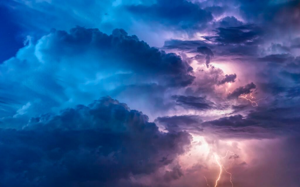 Dark storm clouds building over open land